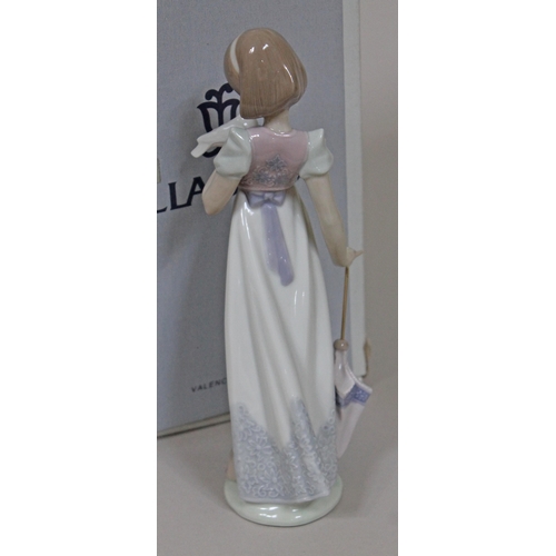 339 - A Lladro figure 'Summer Stroll' number 7611, height 23cm, with box.