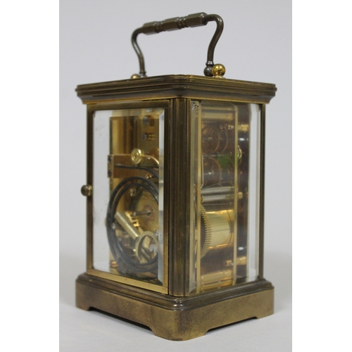 47 - A brass striking carriage clock by Matthew Norman London, height 17cm.