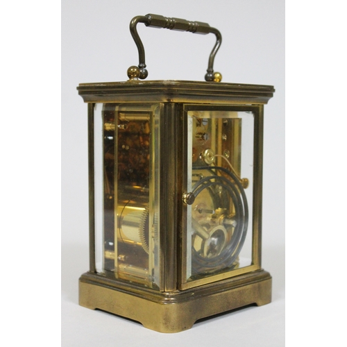 47 - A brass striking carriage clock by Matthew Norman London, height 17cm.