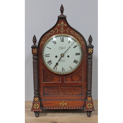 63 - A late Regency brass inlaid mahogany bracket clock, with turned pillars and finials, cockbeading, gi... 