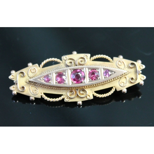 239 - A victorian hallmarked 9ct gold brooch set with amethyst coloured stones, length 46mm, gross wt. 4.7... 