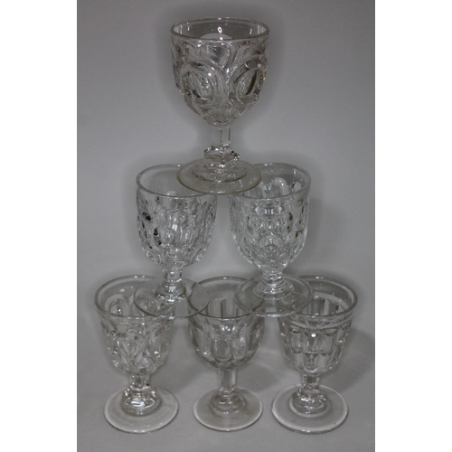 294 - A matched set of six Victorian pressed glass pedestal rummers.