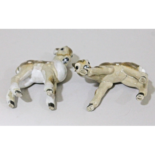 299 - A pair of Keramos Eduard Klabena pottery figures depicting fawns, height 8.5cm & 143cm.