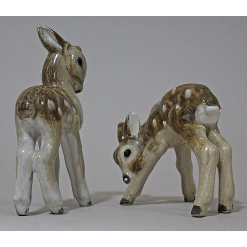 299 - A pair of Keramos Eduard Klabena pottery figures depicting fawns, height 8.5cm & 143cm.