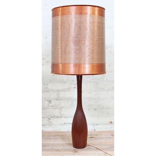 69 - A retro solid teak lamp of slender bottle form with copper bound shade, probably Danish circa 1960s,... 