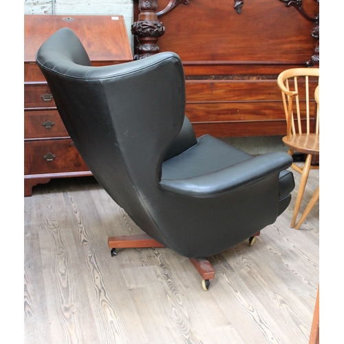 73 - A G-Plan 6250 wing back swivel and reclining lounge chair.