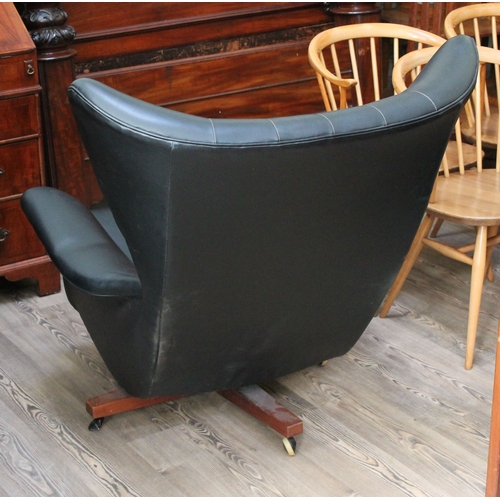 73 - A G-Plan 6250 wing back swivel and reclining lounge chair.