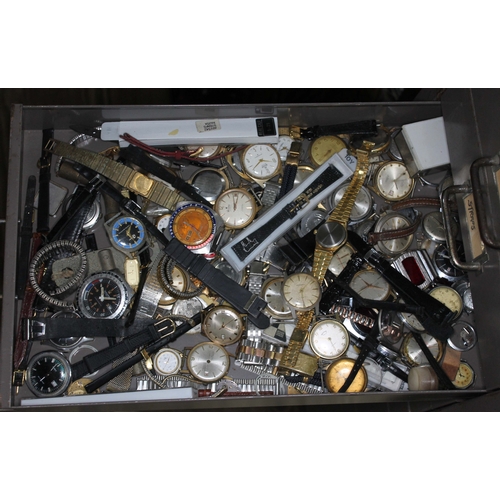 82 - A set of metal file drawers and contents comprising watch spares/repairs and tools, keys etc.