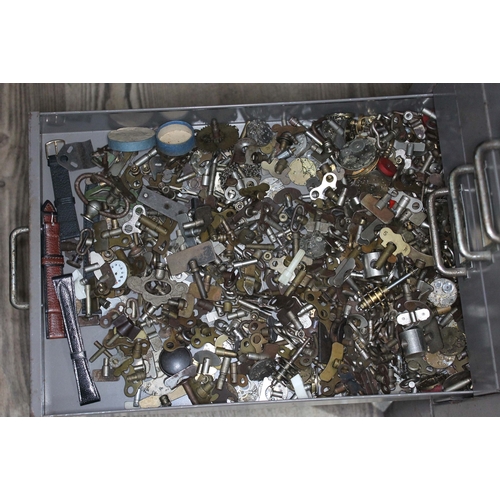 82 - A set of metal file drawers and contents comprising watch spares/repairs and tools, keys etc.