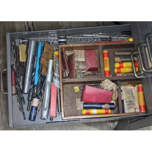 82 - A set of metal file drawers and contents comprising watch spares/repairs and tools, keys etc.