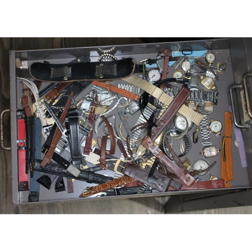 82 - A set of metal file drawers and contents comprising watch spares/repairs and tools, keys etc.