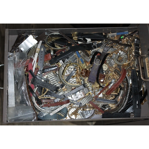 82 - A set of metal file drawers and contents comprising watch spares/repairs and tools, keys etc.