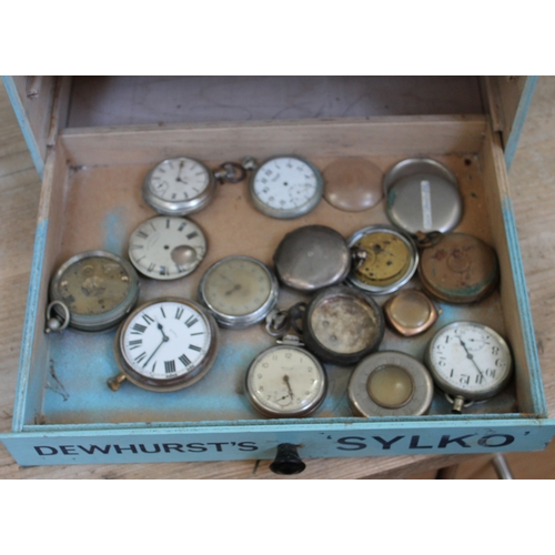 277 - A Dewhursts 'Sylko' cotton bobbin box containing various watch spares.