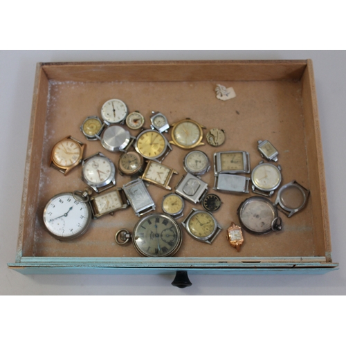 277 - A Dewhursts 'Sylko' cotton bobbin box containing various watch spares.