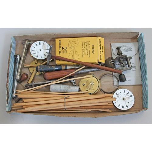 349 - A box of watch maker's tools and spares.