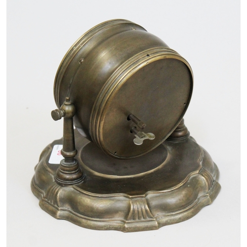 86 - A Continental brass drum clock with monkey barber automated dial, suspended on base, height 15cm.