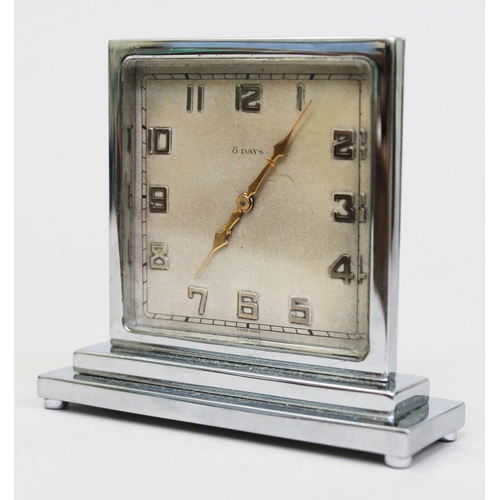 87 - An Art Deco chrome 8 day travel clock, square dial and stepped base, the reverse inscribed 'for the ... 