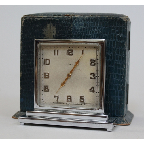 87 - An Art Deco chrome 8 day travel clock, square dial and stepped base, the reverse inscribed 'for the ... 