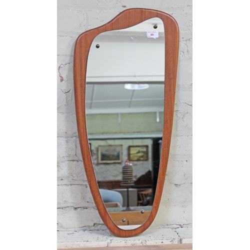 88 - A retro teak mirror, length 79cm.