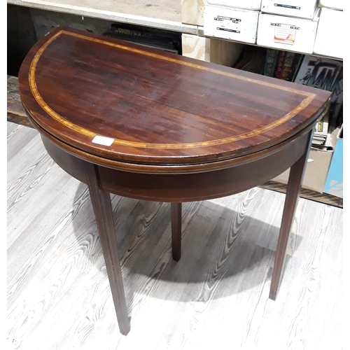 96 - A Georgian mahogany demi-lune fold over tea table, width 76cm, depth 39cm & height 78cm.