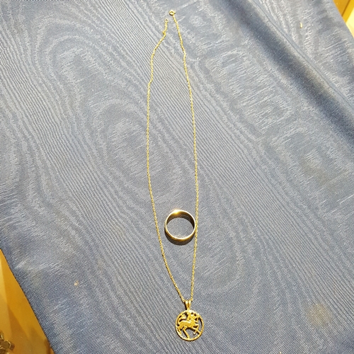 186 - A halmarked 9ct gold pendant and chain together with a 9ct gold ring, wt. 4.6g.