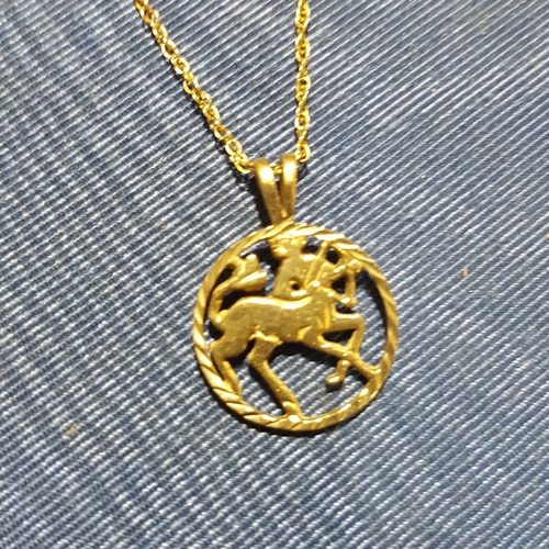 186 - A halmarked 9ct gold pendant and chain together with a 9ct gold ring, wt. 4.6g.