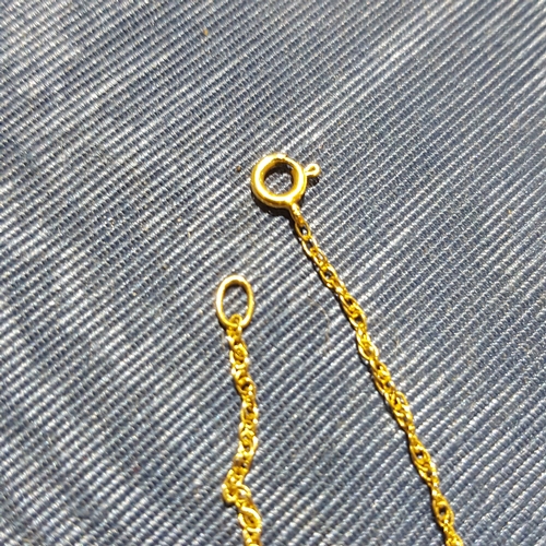 186 - A halmarked 9ct gold pendant and chain together with a 9ct gold ring, wt. 4.6g.