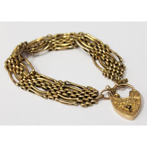 103 - A 9ct gold bracelet with heart locket clasp marked 9ct, the strap marked 9c, gross weight 19.9 grams... 