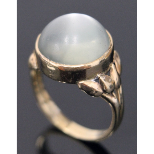 117 - A moonstone cabachon ring, the stone in bezel setting with tulip shoulders, unmarked, size N/O, gros... 