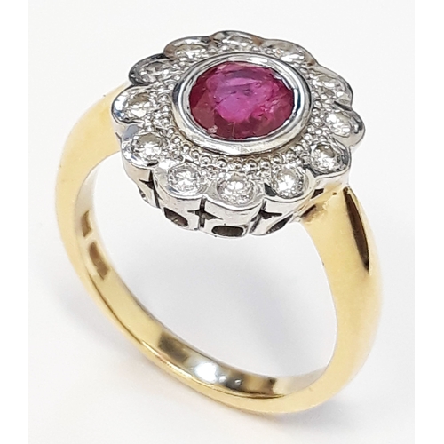 126 - An 18ct gold diamond and ruby cluster ring, the central stone approx 0.75 carats, size O, gross weig... 