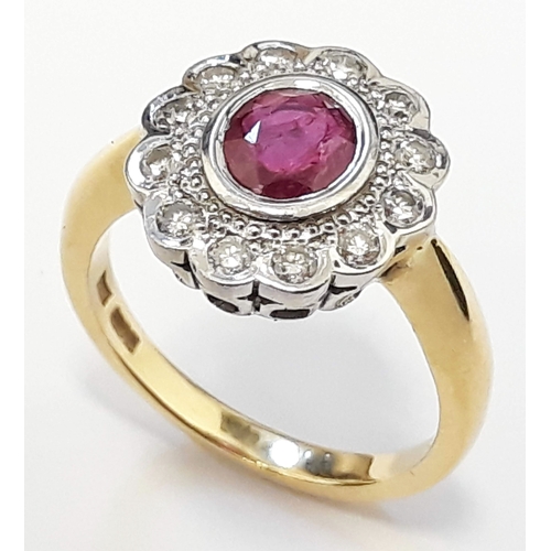 126 - An 18ct gold diamond and ruby cluster ring, the central stone approx 0.75 carats, size O, gross weig... 