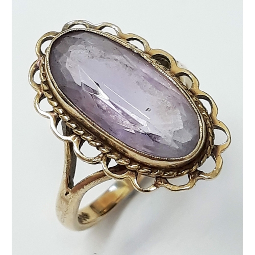 127 - A hallmarked 9ct gold amethyst ring, size J gross wt. 3.4g.