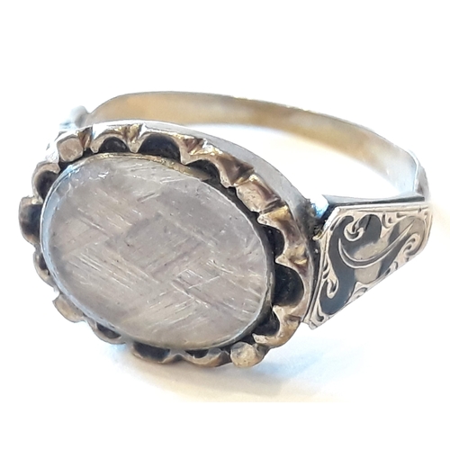 161 - A 19th Century yellow metal mourning ring, size M.