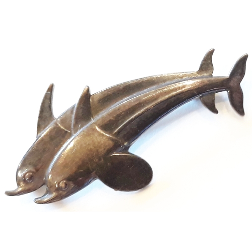 166 - A George Jensen Sterling silver brooch formed as two leaping dolphins, numbered 317, length 41mm.