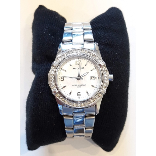 172 - A ladies Accurist stainless steel wristwatch with mother of pearl dial, diam. 29mm.