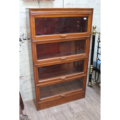 75 - An oak sectional bookcase, width 89cm, depth 28cm & height 153cm.