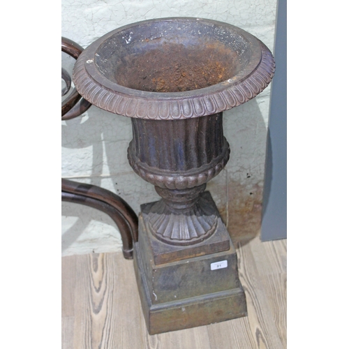 81 - A cast iron garden urn on plinth, height 66cm.