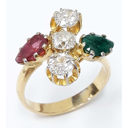 100C - A diamond ruby and emerald cluster ring, the three central stones approx. 0.30 carats each,band unma... 