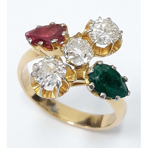 100C - A diamond ruby and emerald cluster ring, the three central stones approx. 0.30 carats each,band unma... 