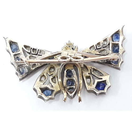 100E - A Victorian sapphire and diamond butterfly brooch, unmarked, length 38mm, gross wt. 8g.