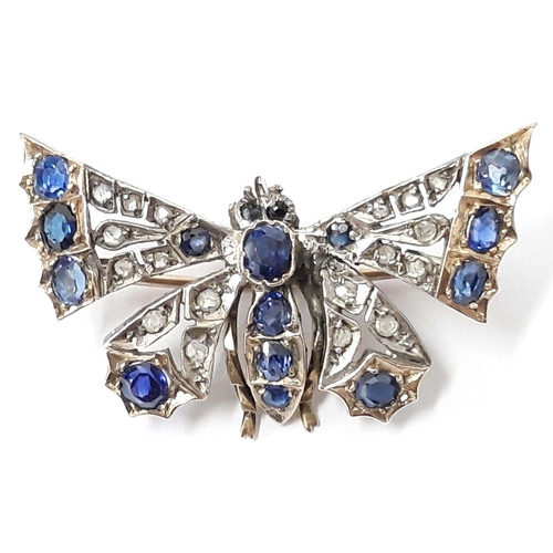 100E - A Victorian sapphire and diamond butterfly brooch, unmarked, length 38mm, gross wt. 8g.