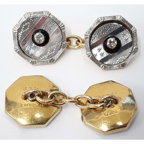 100F - A pair of Art Deco 18ct gold platinum and diamond cufflinks, marked '18ct PLAT', gross wt. 9.8g.