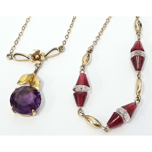 100Q - Two 9ct gold pendants, one set with an amethyst coloured stone, the other with ruby coloured stones,... 