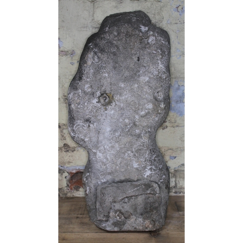 96 - A 20th Century carved stone figure depicting a fertility god, length 67cm.