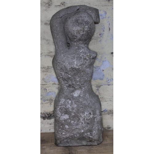 97 - A 20th Century carved stone figure depicting a nude lady with arm raised above head, length 70cm.