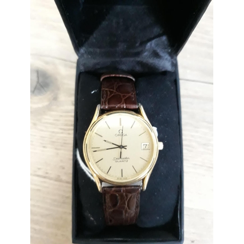 158 - A 1980s gold plated Omega Seamaster Quartz, the gold coloured round dial having gold markers, gold h... 