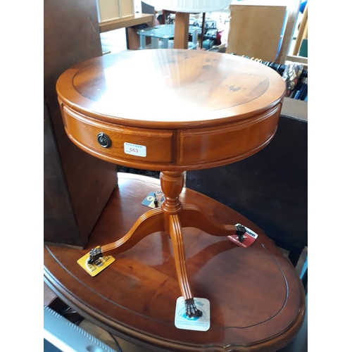 663 - A reproduction yew wood drum table