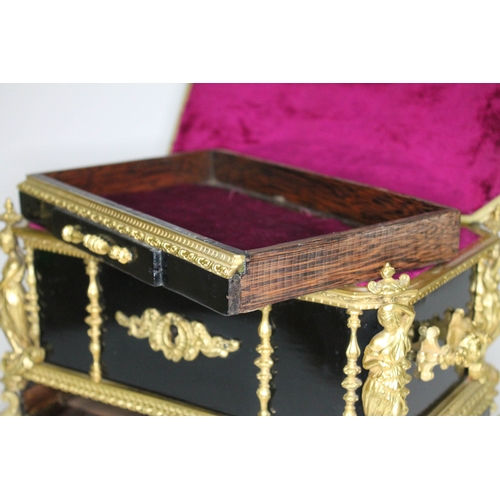 20 - A French 19th century gilt metal and ebonised casket having figural finial and columns, scroll work ... 