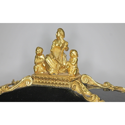 20 - A French 19th century gilt metal and ebonised casket having figural finial and columns, scroll work ... 