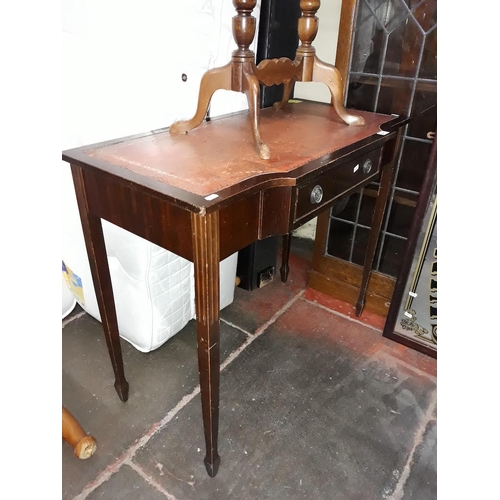 481 - A reproduction side table with tooled leather top and drawer